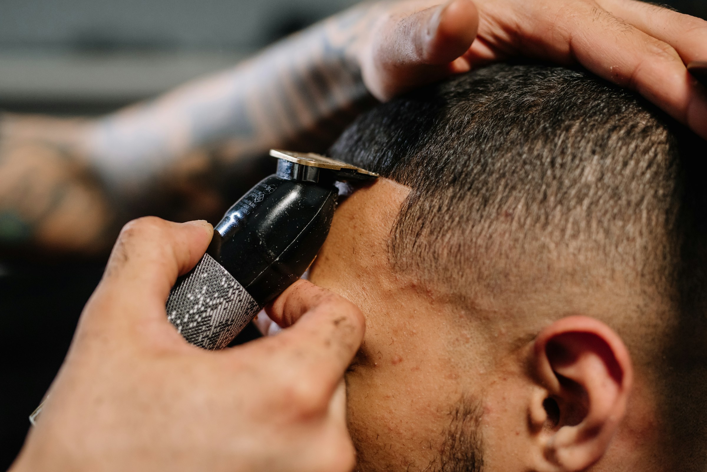 Barber creating a precise fade haircut