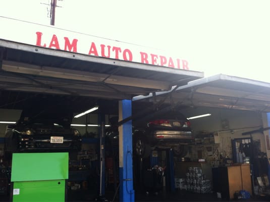 Vehicle being serviced inside Lam Auto Repair